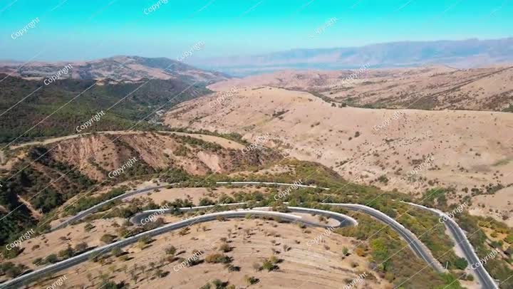 Aerial a mountain road with a drone on a sunny day