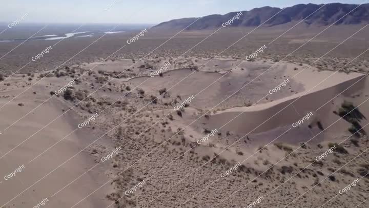 A large sand dune in the middle of the desert