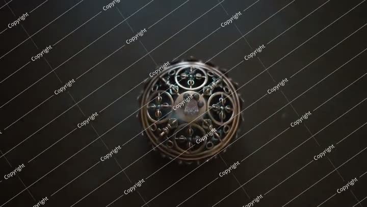 Close up on ancient coptic metal artwork. aromatic incense burning. top view