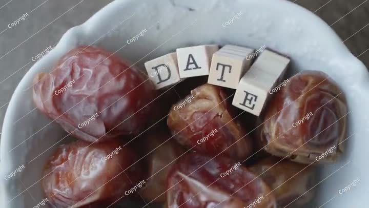 dried fresh dates on a plate macro shot