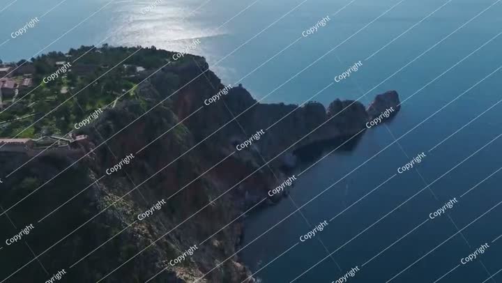 Aerial Video of a Stunning Coastal Fortress Surrounded by Trees, With an Endless