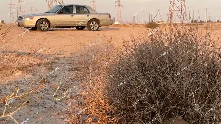 The car is resting and my eyes are resting In the desert of Kuwait. 
