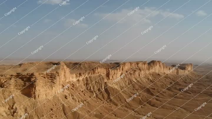 Camera drone flies along the ridge of Jabal Tuwaiq