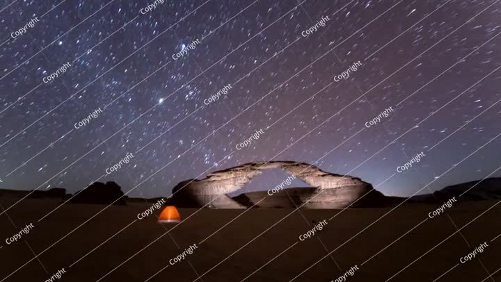 Time lapse of stars in rainbow arch, camping tent, Al ula,   Saudi Arabia