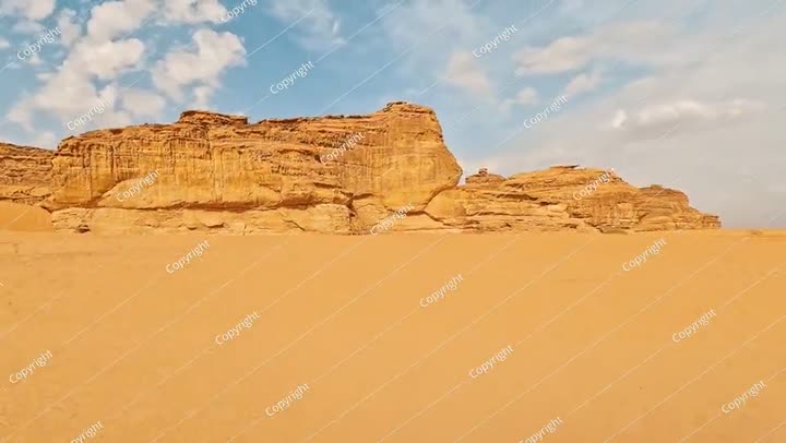Driving in typical desert landscape in Alula, Saudi Arabia, sand with some ..