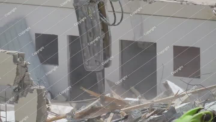 Demolition of residential building in Saudi Arabia Excavator loads and moves
