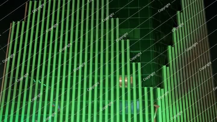 Saudi National Day green-lit skyscraper at night video