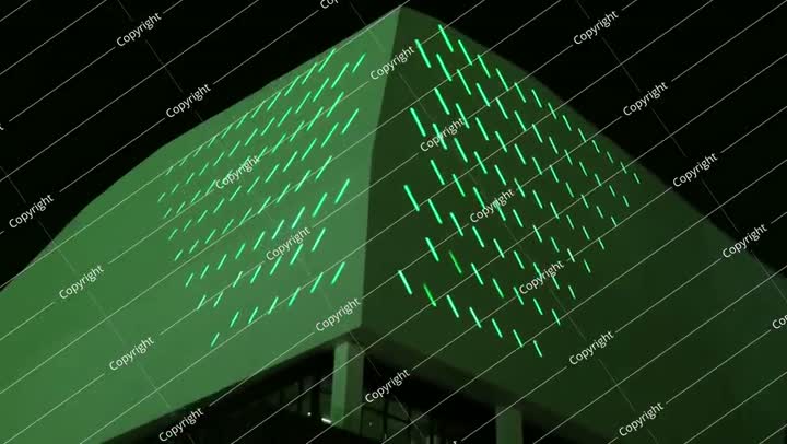 Saudi National Day green-lit skyscraper at night video