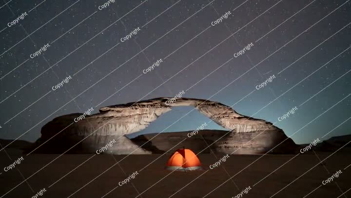Time lapse of stars in rainbow arch, camping tent, Al ula,   Saudi Arabia