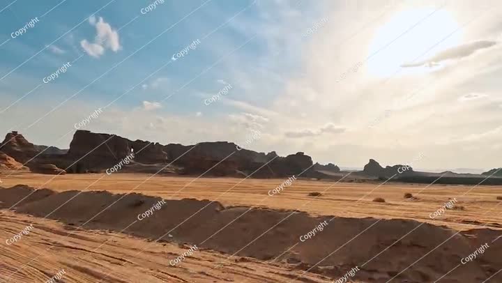 Driving in typical desert landscape in Alula, Saudi Arabia, sand with some ..