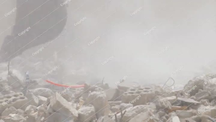 Demolition of residential building in Saudi Arabia Excavator loads and moves