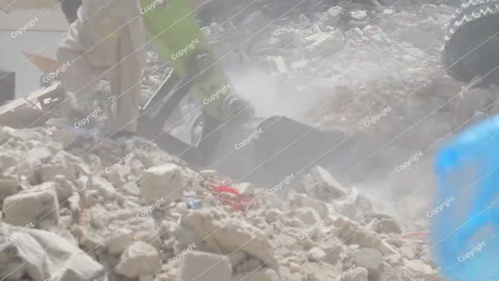 Demolition of residential building in Saudi Arabia Excavator loads and moves