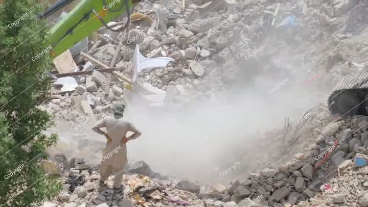 Demolition of residential building in Saudi Arabia Excavator loads and moves
