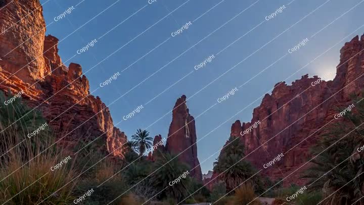 Time lapse of Sunset in Sandstone and Palm Oasis in Wadi Al Disah, Saudi Arabia