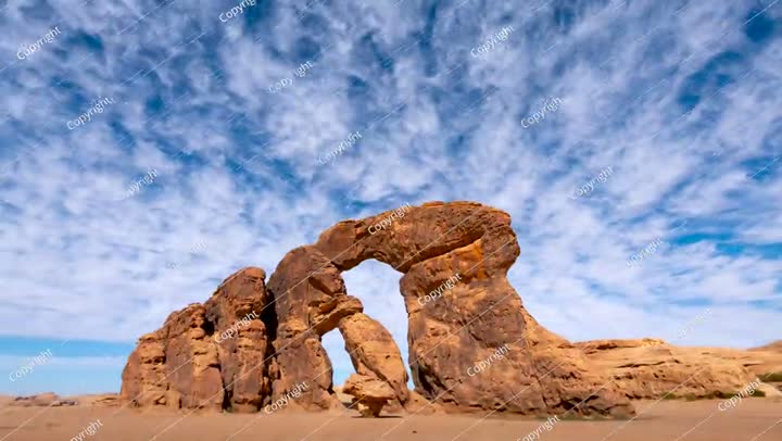 Time lapse of clouds motion over rock shape dancing in Alula,  Saudi Arabia.