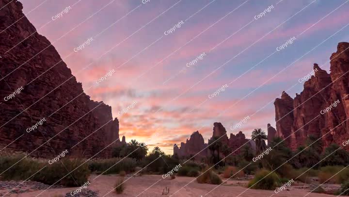 Time lapse of Sunset in Sandstone and Palm Oasis in Wadi Al Disah, Saudi Arabia
