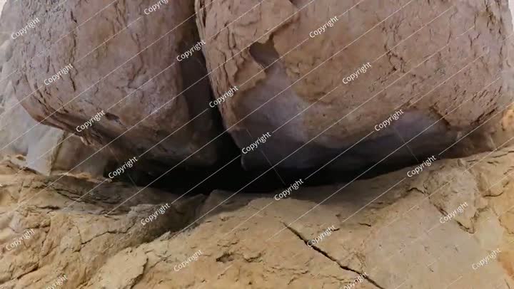 Rocky landscape of Jabal Al Qarah caves under sunset sky in Saudi Arabia