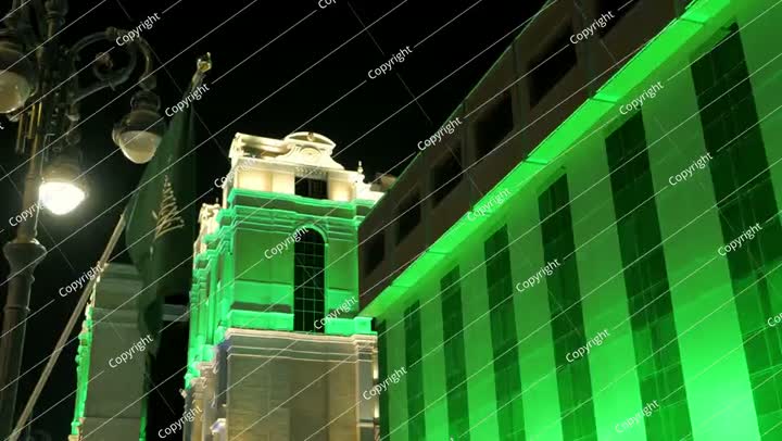 Saudi Flag Waving at Night During National Day Celebration