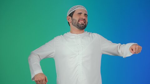 A portrait of an Arab Gulf Emirati man wearing a kandura and a white cap, raising his hands with gestures indicating stretching, the concept of activity and morning awakening, with a colorful background.