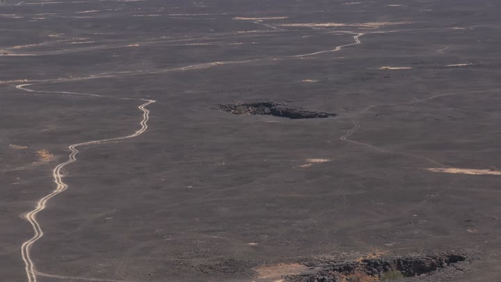 Natural landscapes, the Cave of Umm al-Jarsan in the Harrah of Khaybar north of Medina, ancient natural caves and caverns, carved rocks, tourist spots, natural views.