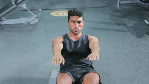 Youth exercises to improve physical fitness, build and strengthen body muscles, bodybuilding, a young Arab Gulf Saudi man wearing sportswear practicing exercises, a healthy lifestyle.