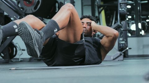 Physical activity for youth to improve fitness, build and strengthen body muscles, bodybuilding, an Arab Gulf Saudi young man wearing sportswear practicing exercises, a healthy lifestyle.