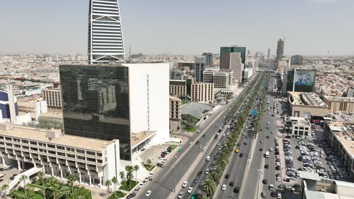 The lifestyle in the capital, King Fahd Road in the Kingdom of Saudi Arabia, urban development and progress, the architectural engineering art of buildings and skyscrapers, drone photography of the Al-Olaya Towers in Riyadh during the day, paved roads and streets.