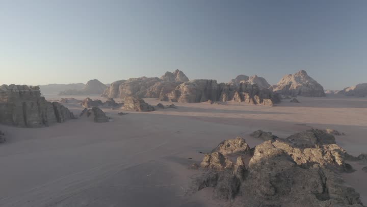 The desert and mountainous nature, the natural rock formations in Al-Ula's Madain Saleh in the Kingdom of Saudi Arabia, drone photography of the mountains and rock formations in Al-Ula, historical archaeological tourist sites and landmarks.