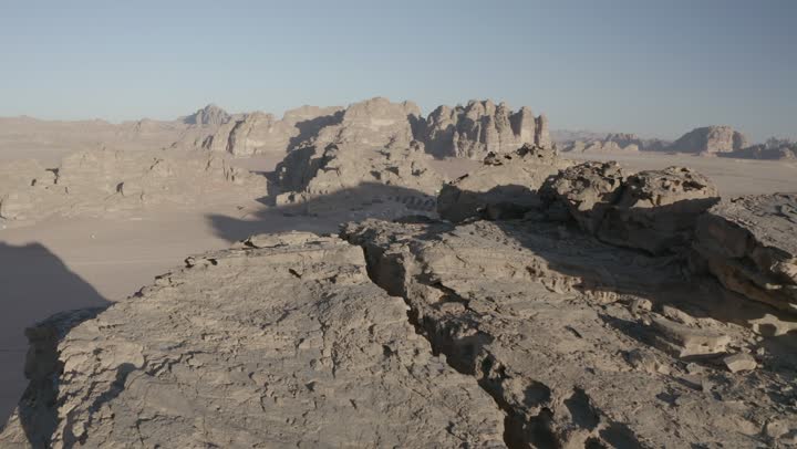 The desert and mountainous nature, the natural rock formations in Al-Ula's Madain Saleh in the Kingdom of Saudi Arabia, drone photography of the mountains and rock formations in Al-Ula, historical archaeological tourist sites and landmarks.