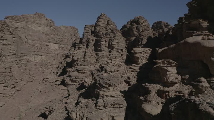 The desert and mountainous nature, the natural rock formations in Al-Ula's Madain Saleh in the Kingdom of Saudi Arabia, drone photography of the mountains and rock formations in Al-Ula, historical archaeological tourist sites and landmarks.