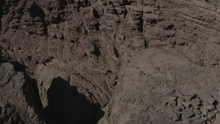 The natural rock formations in Madain Saleh in Al-Ula Governorate, Saudi Arabia, the desert and mountainous nature, drone photography of the mountains and rock formations in Al-Ula Governorate, historical archaeological tourist sites and landmarks.