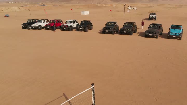 Preparing and organizing car movement in the desert, exciting youth recreational activities, tourism adventures and safari trips, fun and entertainment by practicing the hobby of driving cars on the soft sands in the Kingdom of Saudi Arabia, the natural landscapes and the soft golden sands in the desert.
