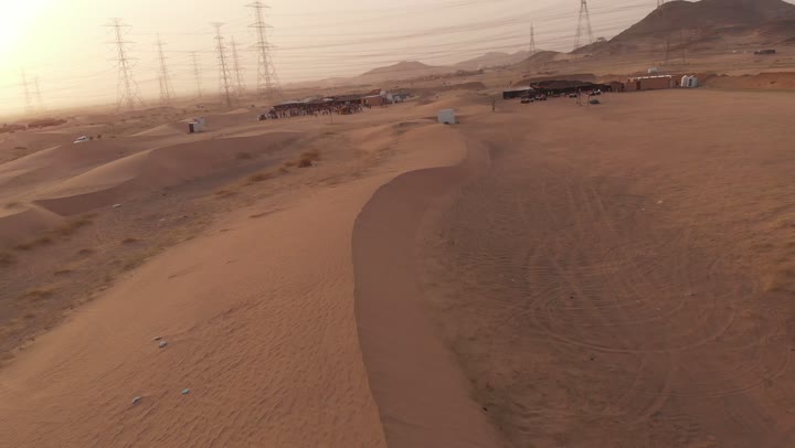 The landscapes and soft golden sands in the desert, the formations and sand structures in the deserts, the harsh and dry climate in arid lands, the soft golden dunes and natural topography in the Kingdom of Saudi Arabia, the backdrop of nature.