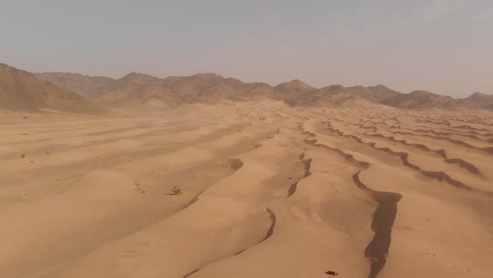 The harsh and dry weather in arid lands, spending time in the desert with friends, the landscapes and soft golden sands in the desert, the formations and shapes of sand in the deserts, the soft golden dunes and natural terrain in the Kingdom of Saudi Arabia, the backdrop of nature.