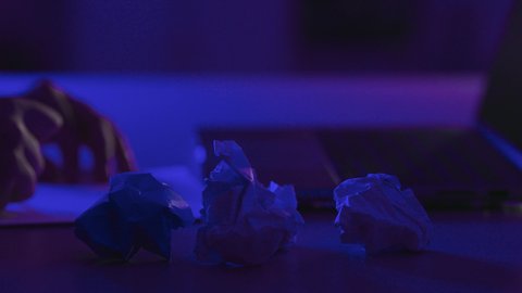 Business management and organization, using blank white papers at work, a young Saudi woman is jotting down and recording notes and information on paper, a close-up shot of the hand of a Gulf Arab Saudi woman writing daily tasks and goals.