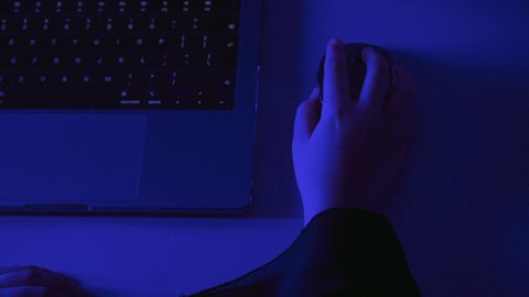 Text content creation, data entry concept, administrative office jobs and professions, integrating modern technology into practical life, close-up shot of the hands of a Saudi Arabian Gulf woman using a laptop mouse, working on a laptop.