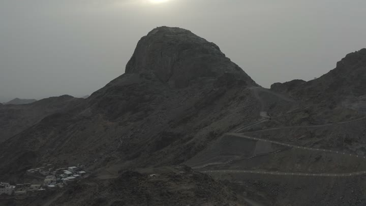 Aerial drone photography of Mount Noor in Mecca, the mountain's terrain, natural lighting.