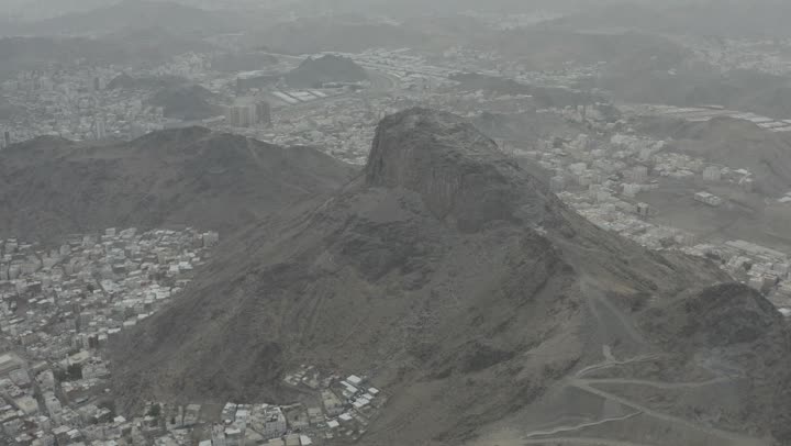 Aerial drone photography of Mount Noor in Mecca, the mountain's terrain, natural lighting.