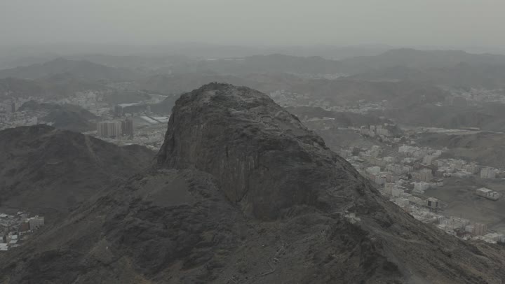 Aerial drone photography of Mount Noor in Mecca, the mountain's terrain, natural lighting.