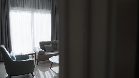 Luxurious and beautiful designs, showcasing a living room with a modern design, photography of the living room, contemporary and attractive designs, stunning decorations, upscale home furniture, residential apartments.