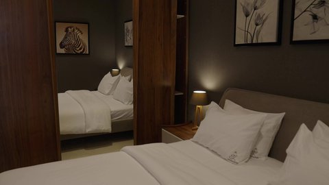 Furnished apartments for tourist accommodation, a bedroom in a residential apartment with modern and attractive designs, wonderful decorations, upscale home furniture, stunning and beautiful designs, hotel, luxury hotels.