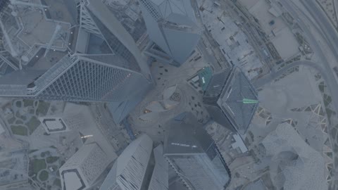 King Abdullah Financial District (KAFD), urban growth and development in Saudi Arabia, achieving economic and commercial renaissance, aerial drone photography of the surroundings of the financial institutions and towers in Riyadh, the architectural engineering art of the famous buildings and skyscrapers in the Kingdom.