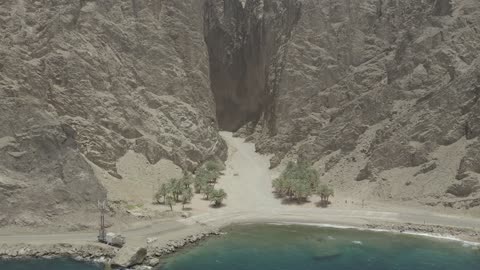 The eastern coast of the Gulf of Aqaba, areas of tourism development projects, rock formations and structures in Wadi Tayeb Asm in the Tabuk region, mountain ranges in desert areas, drone photography of the terrain and rock carvings in famous historical archaeological sites in Saudi Arabia.