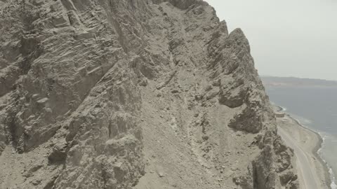 The eastern coast of the Gulf of Aqaba, areas of tourism development projects, rock formations and structures in Wadi Tayeb Asm in the Tabuk region, mountain ranges in desert areas, drone photography of the terrain and rock carvings in famous historical archaeological sites in Saudi Arabia.