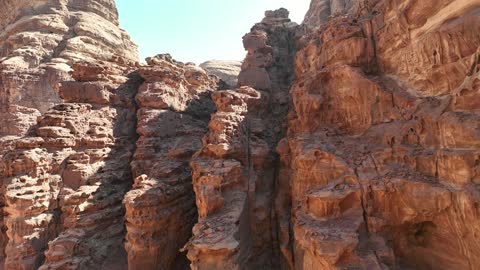 A luxurious mountain tourist destination, a global center for winter sports and adventures, drone photography of the towering mountains with rock formations in the Tabuk region, the Jeddah desert in Neom, northwest of the Kingdom of Saudi Arabia.