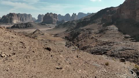 A luxurious mountain tourist destination, a global center for winter sports and adventures, drone photography of the towering mountains with rock formations in the Tabuk region, the Jeddah desert in Neom, northwest of the Kingdom of Saudi Arabia.