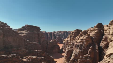 A luxurious mountain tourist destination, a global center for winter sports and adventures, drone photography of the towering mountains with rock formations in the Tabuk region, the Jeddah desert in Neom, northwest of the Kingdom of Saudi Arabia.