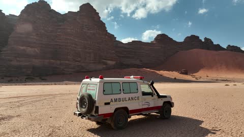 A luxurious mountain tourist destination, a global center for winter sports and adventures, drone photography of the towering mountains with rock formations in the Tabuk region, the Jeddah desert in Neom, northwest of the Kingdom of Saudi Arabia.