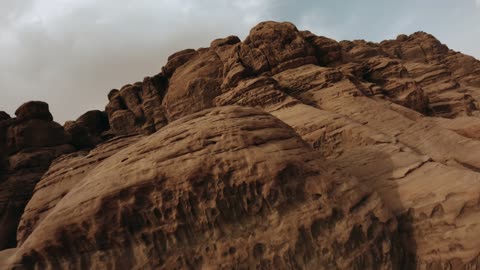 The beauty of the desert landscapes in Saudi Arabia, a global center for winter sports and adventures, drone photography of the towering mountains with rock formations in the Tabuk region, desert in Jeddah in Neom, northwest of the Kingdom of Saudi Arabia, a luxurious mountain tourist destination.