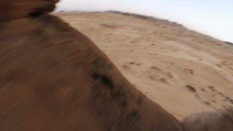 The beauty of the desert landscapes in Saudi Arabia, a global center for winter sports and adventures, drone photography of the towering mountains with rock formations in the Tabuk region, desert in Jeddah in Neom, northwest of the Kingdom of Saudi Arabia, a luxurious mountain tourist destination.